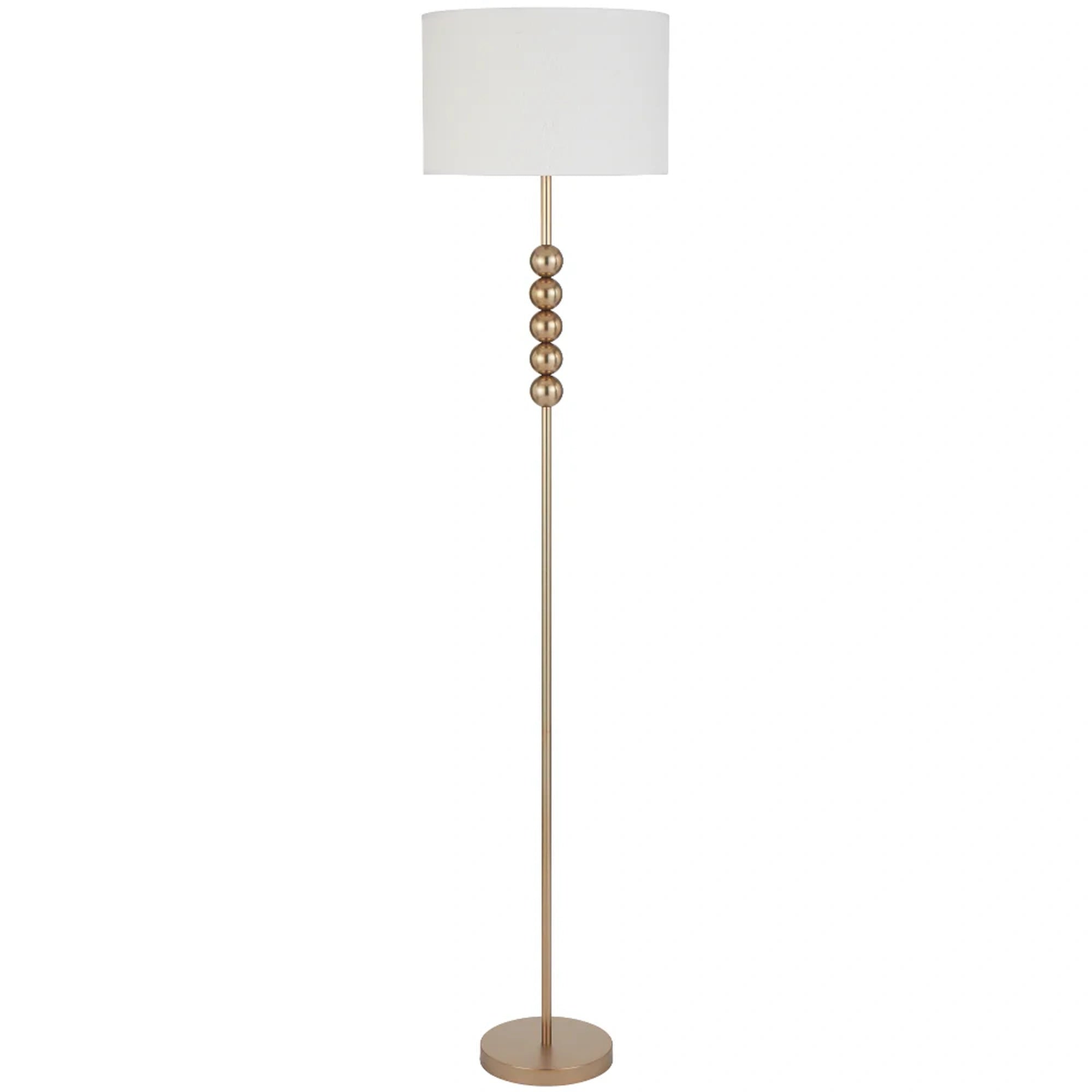 Floor lamp with a white shade and gold base on a white background