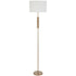 Floor lamp with a white shade and gold base on a white background